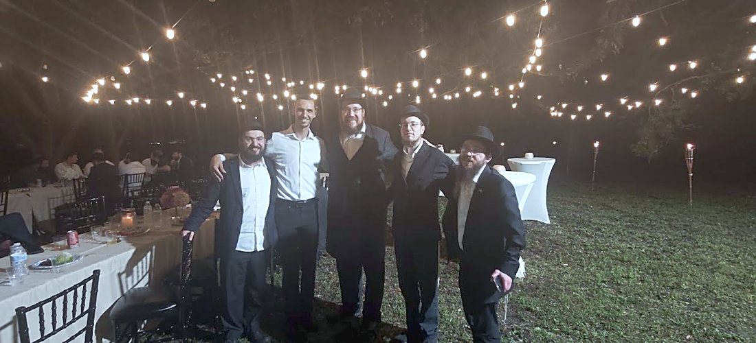 The whole chevra under the night lights
