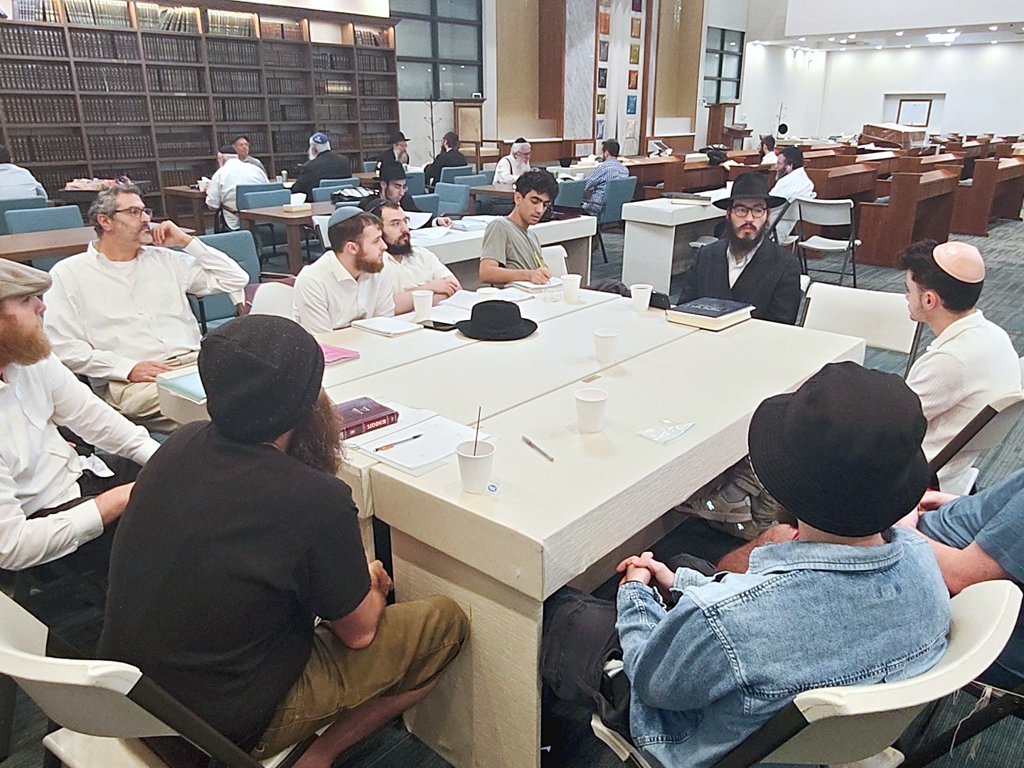 Morning seder — full room over open Gemaras